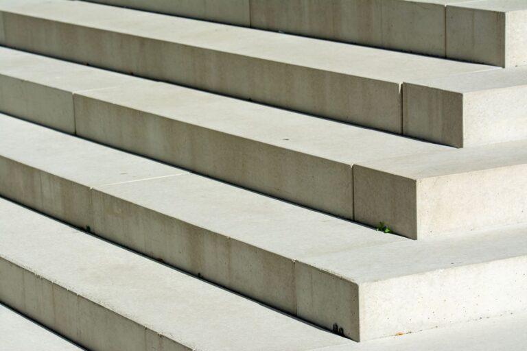 Close-up of modern concrete stairs showing geometric patterns and urban aesthetics.